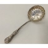 An unusual silver Kings' pattern sifter spoon with