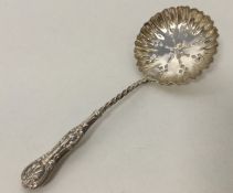 An unusual silver Kings' pattern sifter spoon with