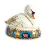 A Royal Crown Derby paperweight modelled as a swan, with a gold coloured stopper, h.