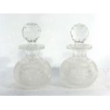 A pair of Edwardian hobnail cut scent bottles and stoppers, h.
