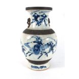 A Chinese crackle glaze blue and white vase of baluster form decorated with warriors in action, h.