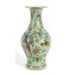 A Cantonese vase of slender baluster form typically decorated in coloured enamels with an exotic