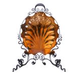 An Art Nouveau-type copper and wrought iron fire screen of shell form, h.