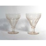 A pair of 19th century glass drinking vessels, the rims etched with fruiting vines, h.