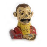 A cast aluminium and painted novelty money box in the form of a gentleman eating