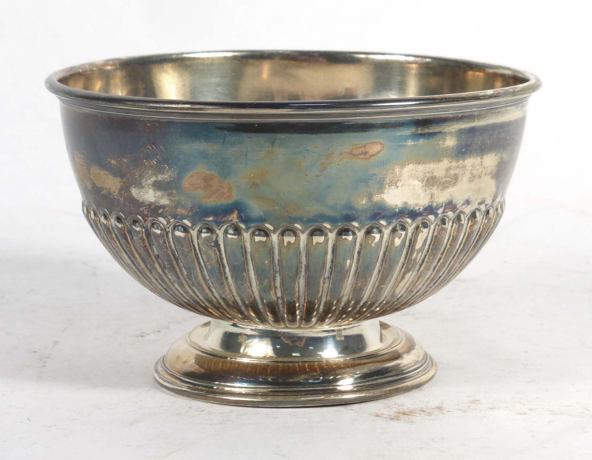 An Edwardian silver bowl with gadrooned decoration raised on a circular foot, F Bros. Ltd.