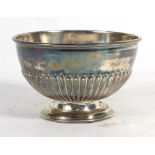 An Edwardian silver bowl with gadrooned decoration raised on a circular foot, F Bros. Ltd.