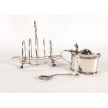 A late Victorian silver four slice toast rack of boat shaped form on claw feet, maker WE, London ,