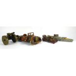A mixed group of tinplate clockwork military models including a Tri-ang tank,