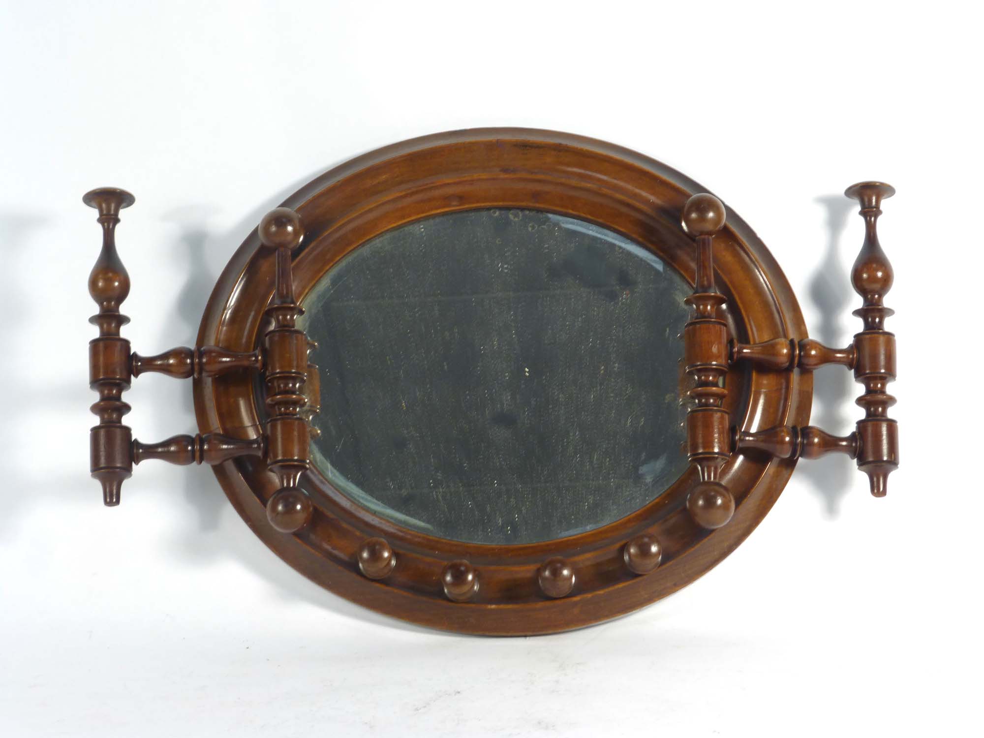 A Victorian walnut shaving mirror with folding arms, w.