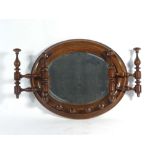 A Victorian walnut shaving mirror with folding arms, w.
