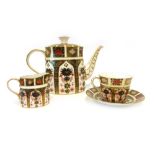 A Royal Crown Derby teaset decorated in the 'Old Imari' 1128 pattern including a teapot and stand,