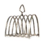 A silver six slice toast rack of arched form, maker BBS Ltd. Birmingham 1934, h. 12.