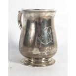 A George III silver mug of bellied form with c-scroll handle, maker TW, London 1772, h. 9.