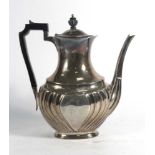 An early 20th century silver coffee pot of vase shaped form with gadrooned decoration, maker HA,