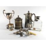 A large quantity of silver plated items including a two handled tray, a spirit kettle,