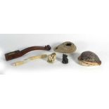 A group of collectables including a 16th century hand oil lap, a 19th century ivory netsuke,