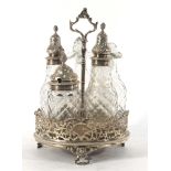 A Victorian silver five bottle condiments stand of circular form,