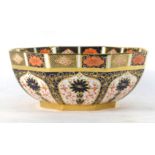 A Royal Crown Derby octagonal bowl decorated in the 'Old Imari' 1128 pattern on a gilt base, d.