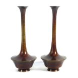 A pair of Japanese brown patinated bronze vases of slender elongated form, h. 20.