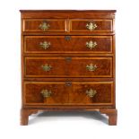 A 19th century walnut and strung chest of two short over three long graduated drawers on bracket