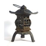A cast metal garden lantern in the Chinese manner, h. 25.