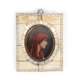 An early 20th century miniature head and shoulders portrait of a lady in a red shroud,