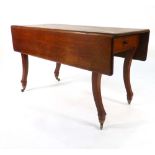 A 19th century mahogany oversized Pembroke-type table with drop-leaves, frieze drawer,