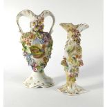 A graduated set of four Continental-type florally encrusted twin-handled vases together with a near