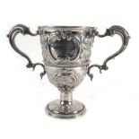 A George III silver and parcel gilt two handled trophy vase of typical form having a pair of leaf