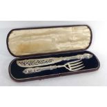 A cased pair of Victorian silver fish servers, each handle of rococo design, maker JG,