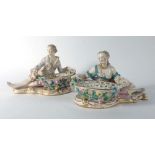 A pair of 19th century figural dishes modelled as a dandy and his female companion each holding a
