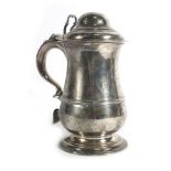 A George III silver covered tankard of plain baluster form raised on a circular foot, John Payne,