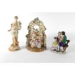 A 19th century Continental figural group modelled as a pair seated in a garden,