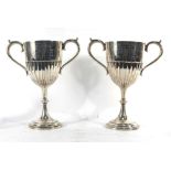 A pair of Edwardian silver two handled trophy vases,