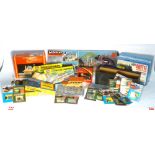 A mixed group of OO/HO gauge accessories including trackside buildings, controller, modelling kits,