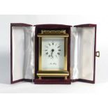 A John Morley timepiece, the face with Roman and Arabic numerals within a brass and five glass case,