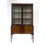 An Edwardian mahogany, strung and inlaid display cabinet,