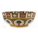 A Royal Crown Derby octagonal bowl decorated in the 'Old Imari' 1128 pattern on a gilt base, d.