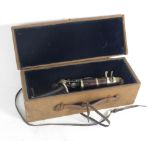 A Riviere & Hawkes rosewood five piece clarinet