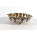 A Victorian miniature pressed silver dish of circular form raised on three bun feet, maker JD WD,