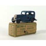 A Tri-ang Minic tinplate clockwork car modelled as a Ford Saloon,
