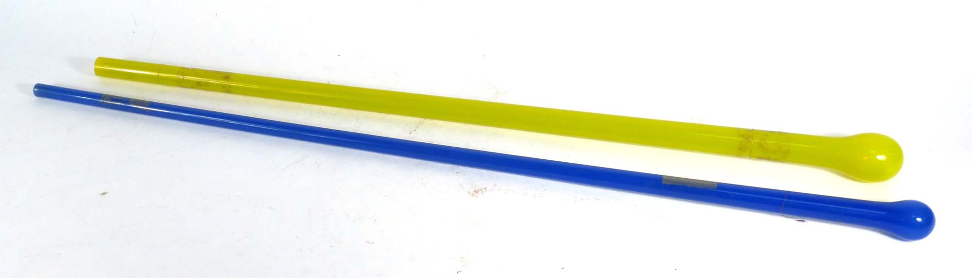 Two Victorian moulded glass tapering walking sticks in blue and yellow