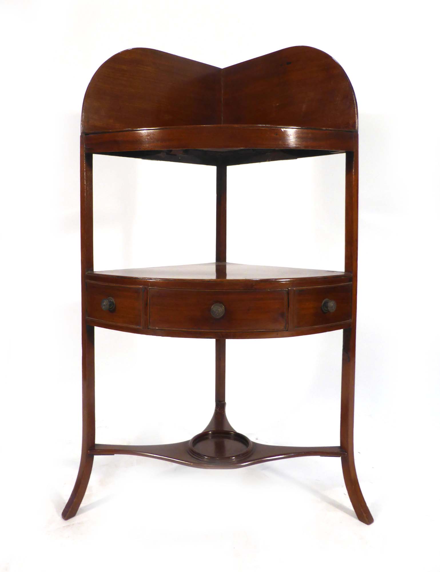 A 19th century mahogany corner washstand with three frieze drawers on splayed feet, w.