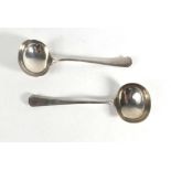 A pair of silver canted end sauce ladles, maker JBC & S Ltd., Birmingham 1934, 5.