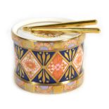A Royal Crown Derby paperweight modelled as a drum together with two drumsticks CONDITION