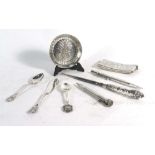 A mixed parcel of items including an engraved silver card case, a miniature metalware's charger,
