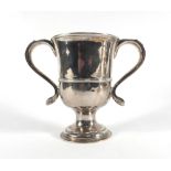 A George III silver two handled trophy vase of typical form having a pair of c-scroll handles above