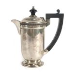 An Edwardian silver bachelor's hot water pot of vase shaped form, maker TS, Birmingham 1934, h.