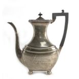 An early 20th century silver coffee pot of vase shaped form on spherical feet, James Dixon & Sons,